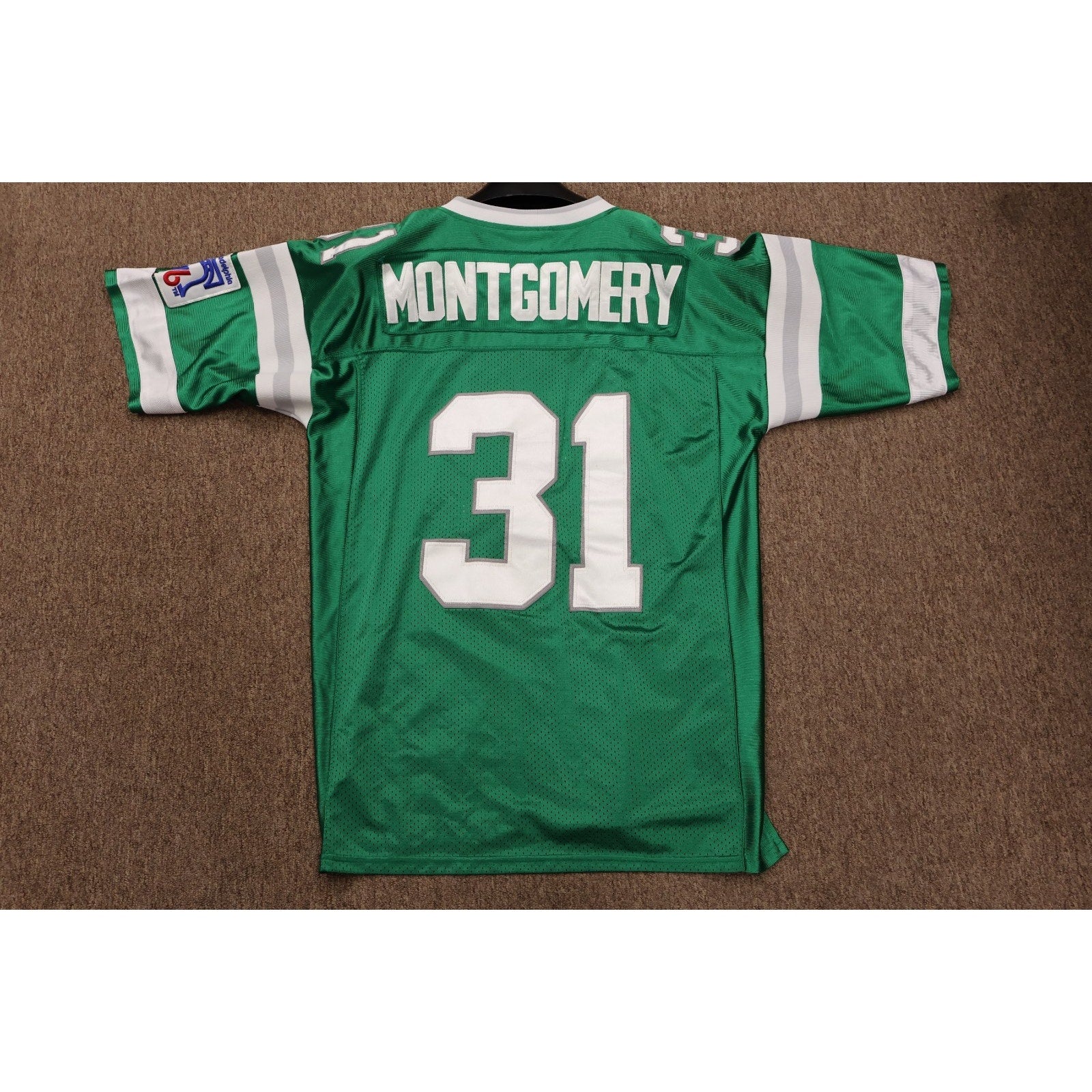 Rear view of green Eagles Wilbert Montgomery number 31 jersey