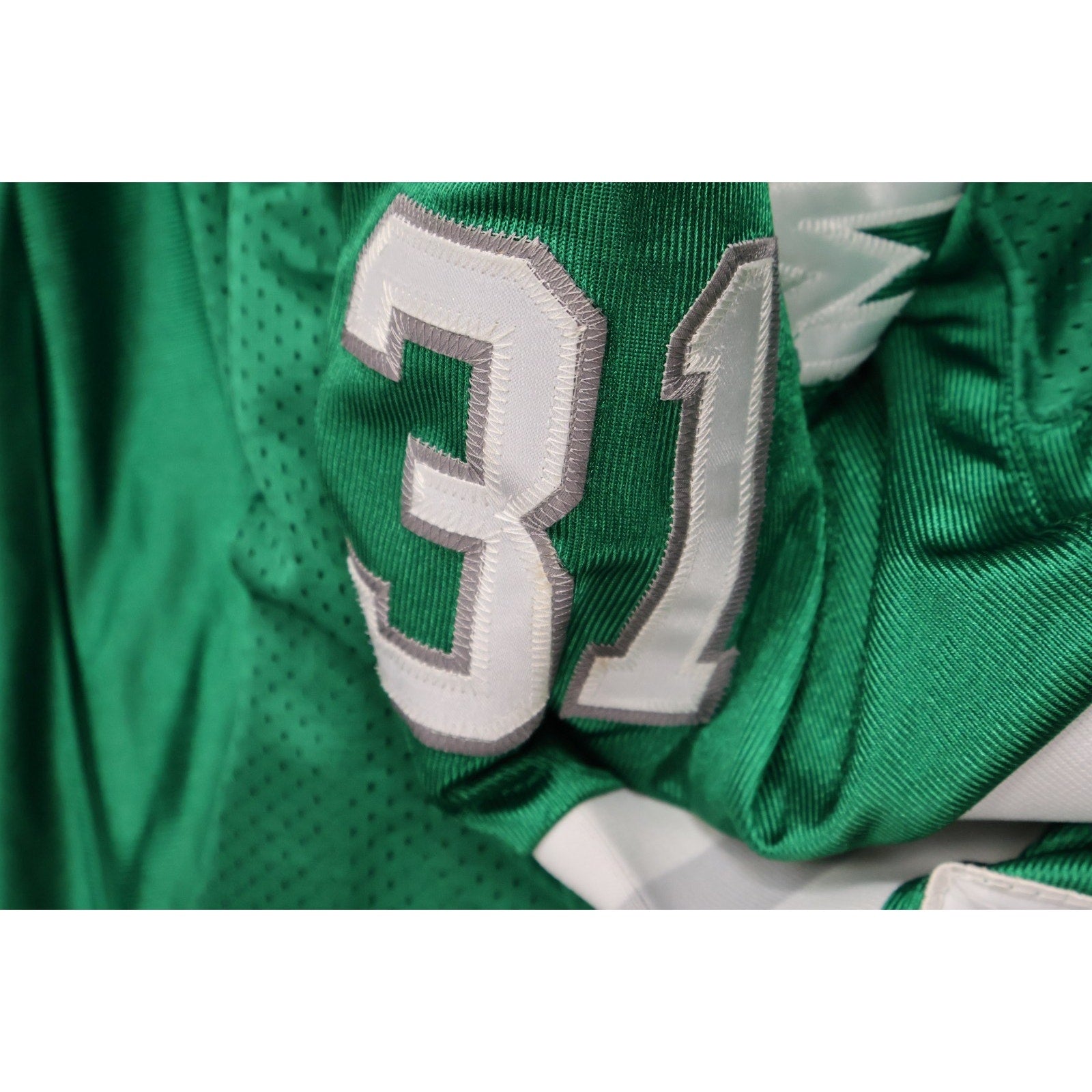 Interior tag and commemorative patch detail on Mitchell and Ness Eagles jersey