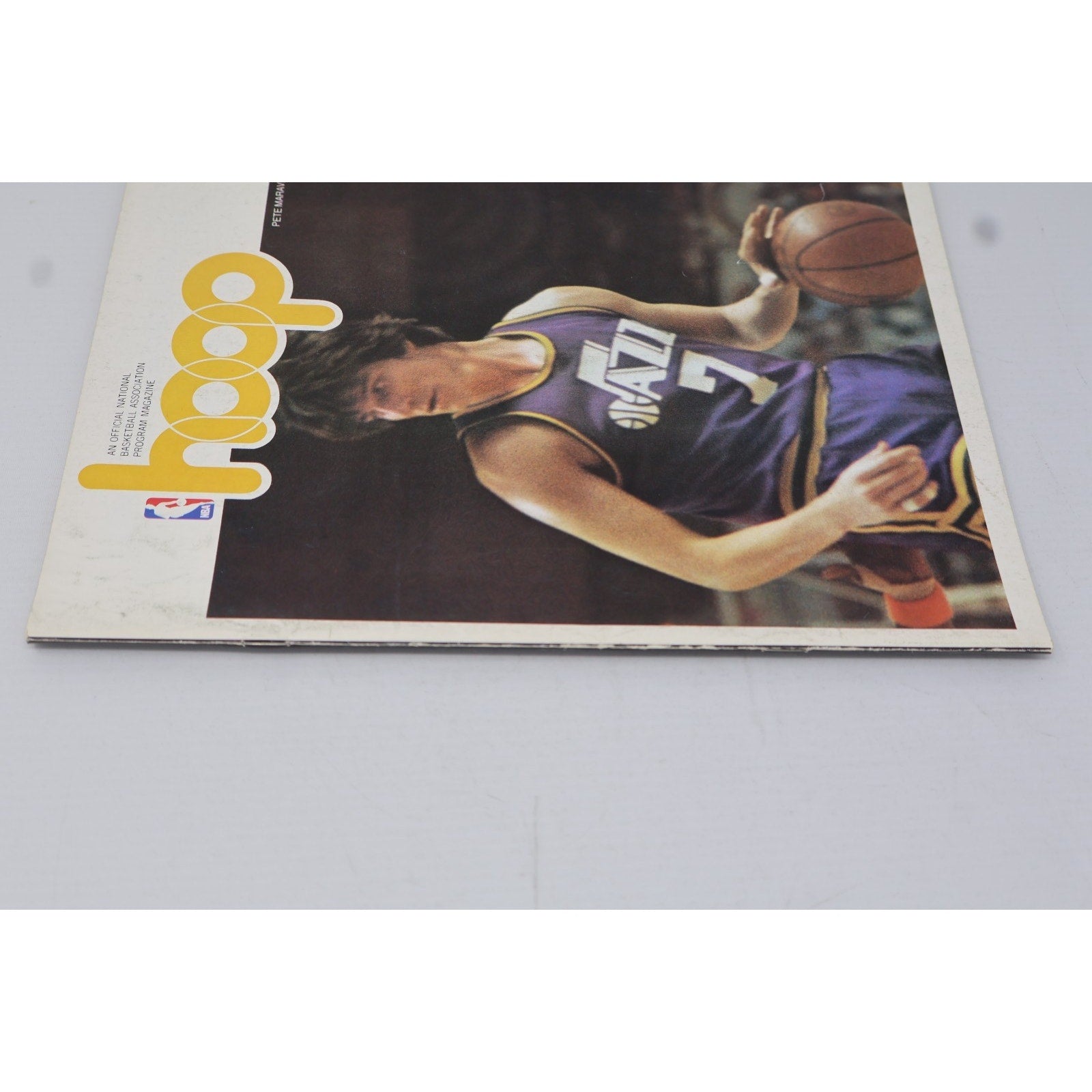 Front cover angled view of vintage 1978 Hoop basketball program featuring Pete Maravich and Utah Jazz artwork