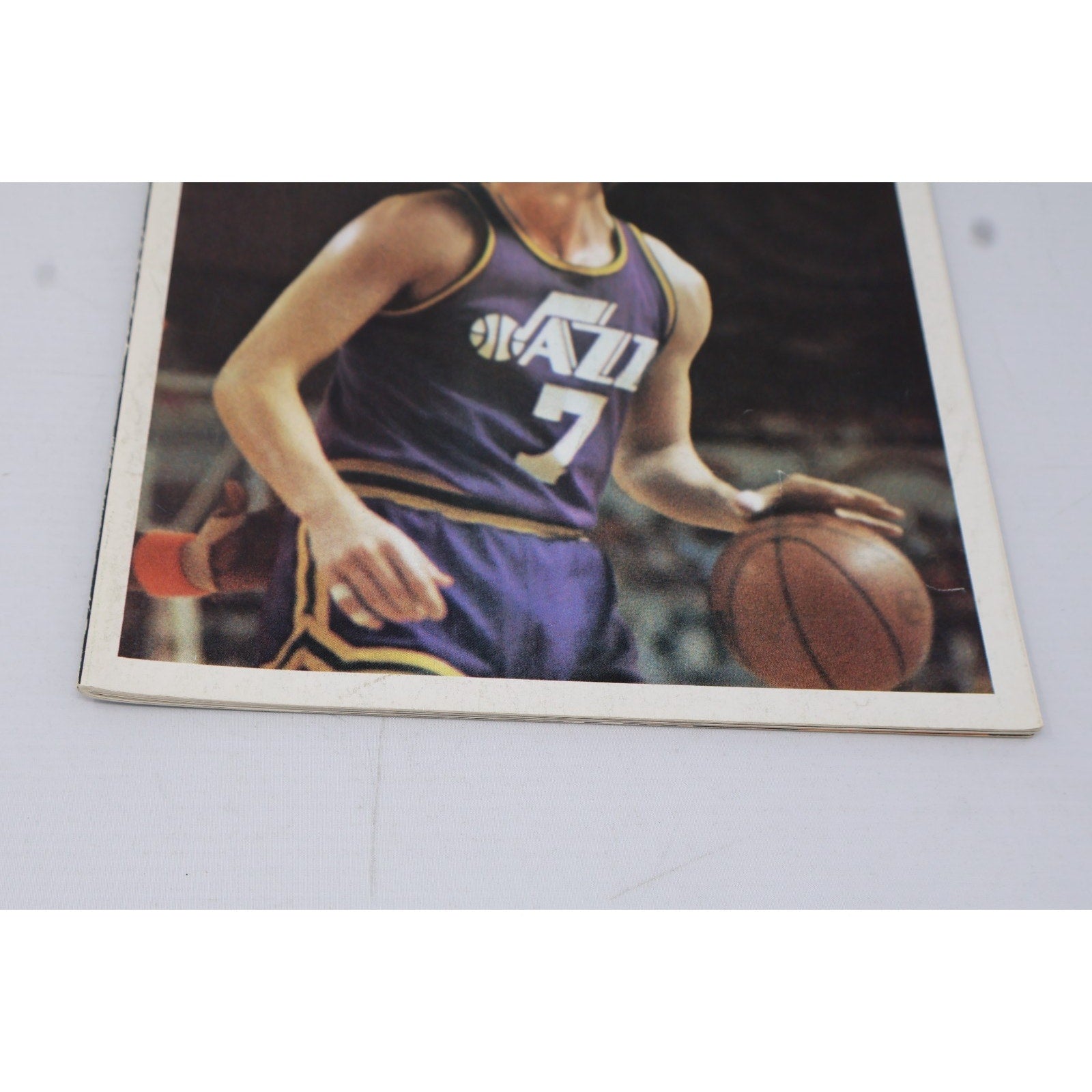 Close-up of Pete Maravich cover artwork from 1978 Washington Bullets vs Utah Jazz Hoop program