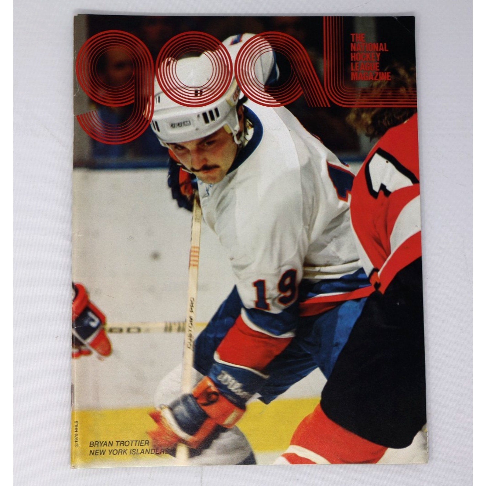 Close-up of vintage 1978 Goal hockey program cover featuring Bryan Trottier during Washington Capitals and New York Islanders matchup