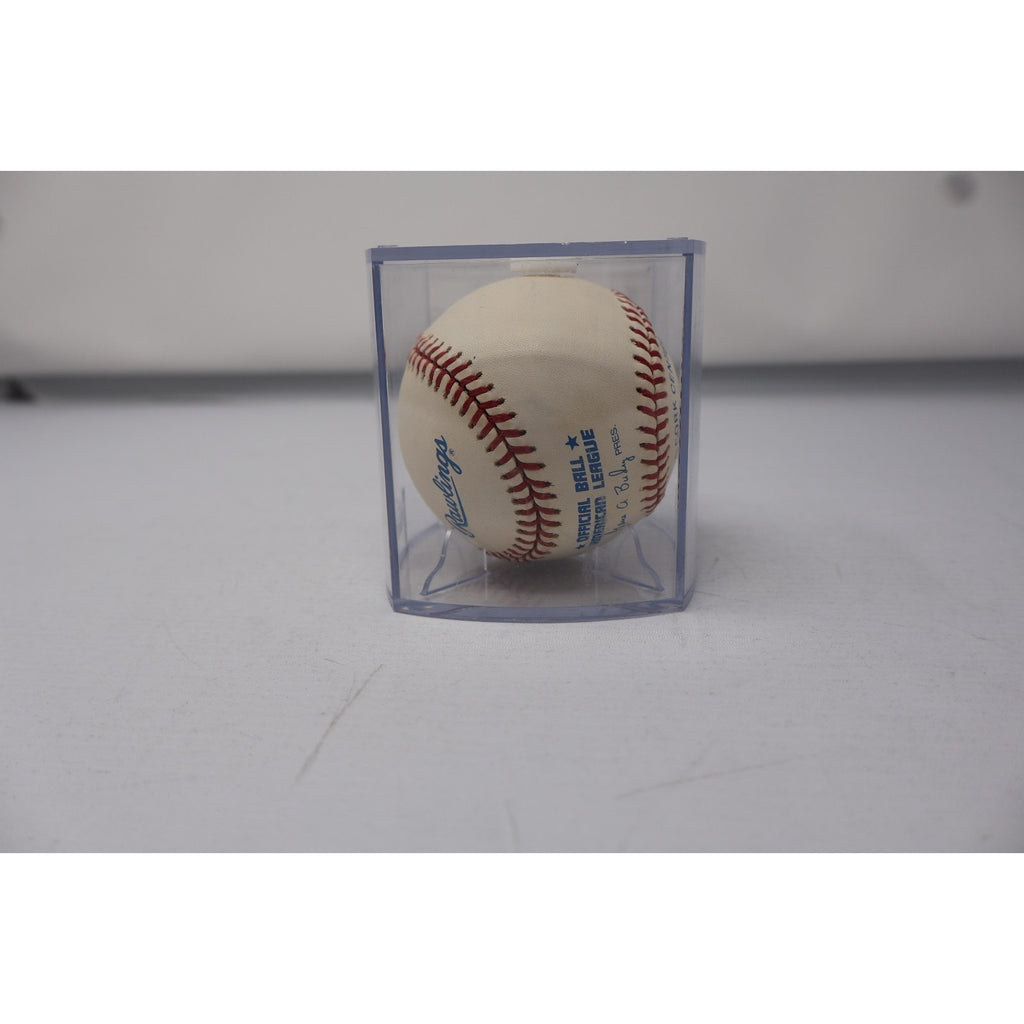 Side view of autographed Whitey Ford baseball in clear display case