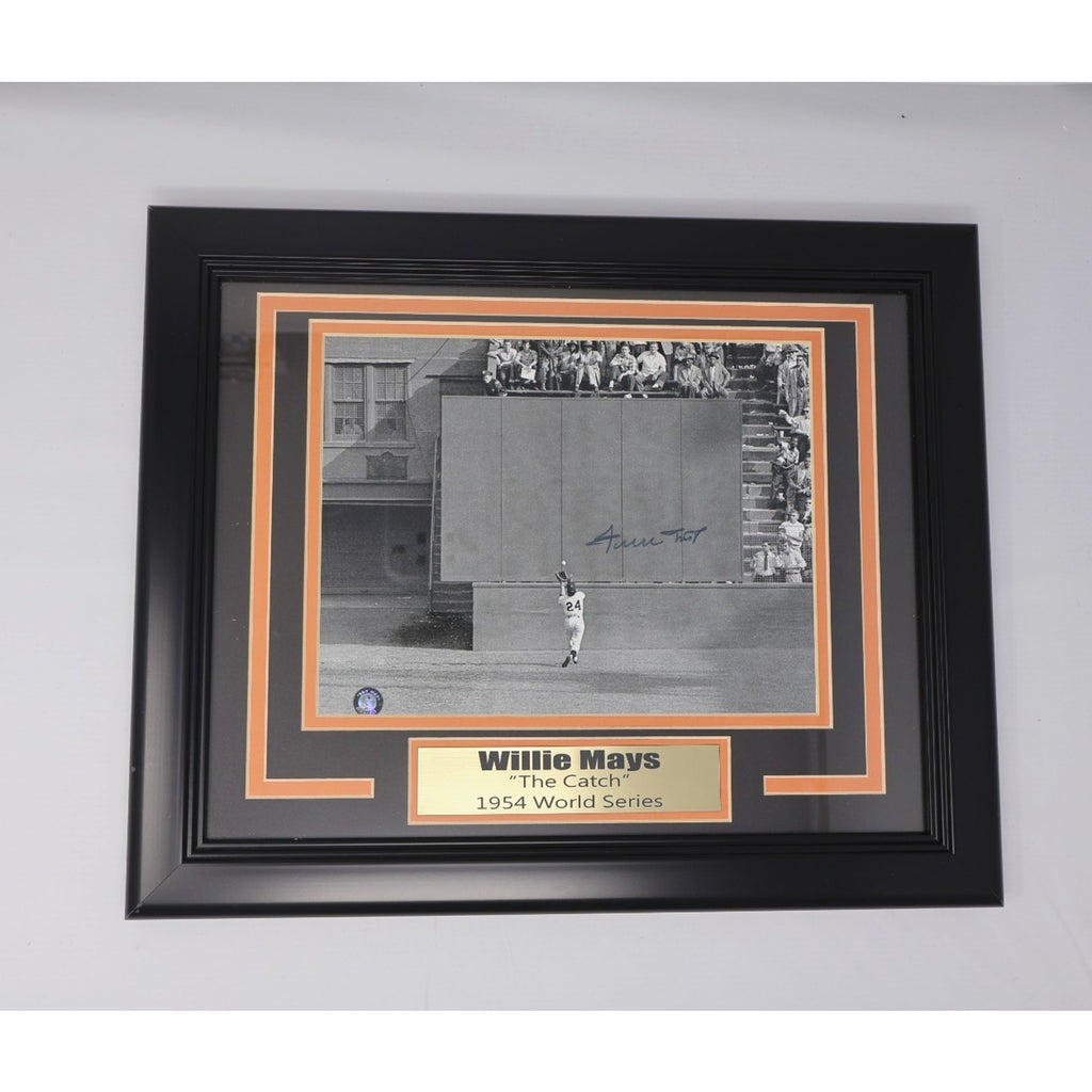 Framed Willie Mays “The Catch” signed photograph display with decorative black and orange matting