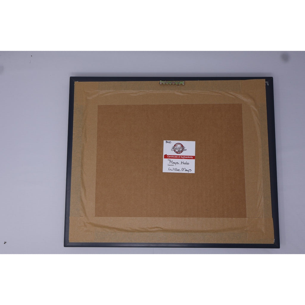 Backside of framed Willie Mays autograph display with hanging hardware and authentication label