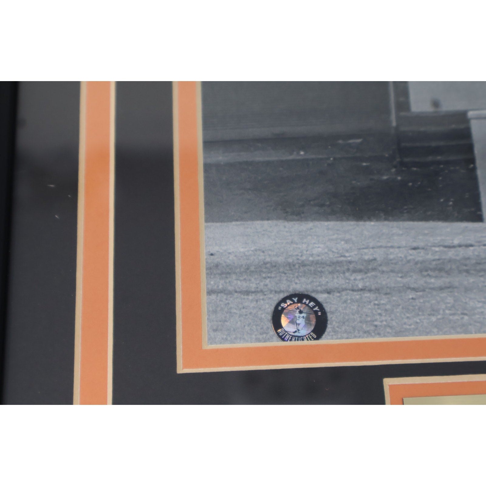Close-up view of Willie Mays signature on “The Catch” photograph