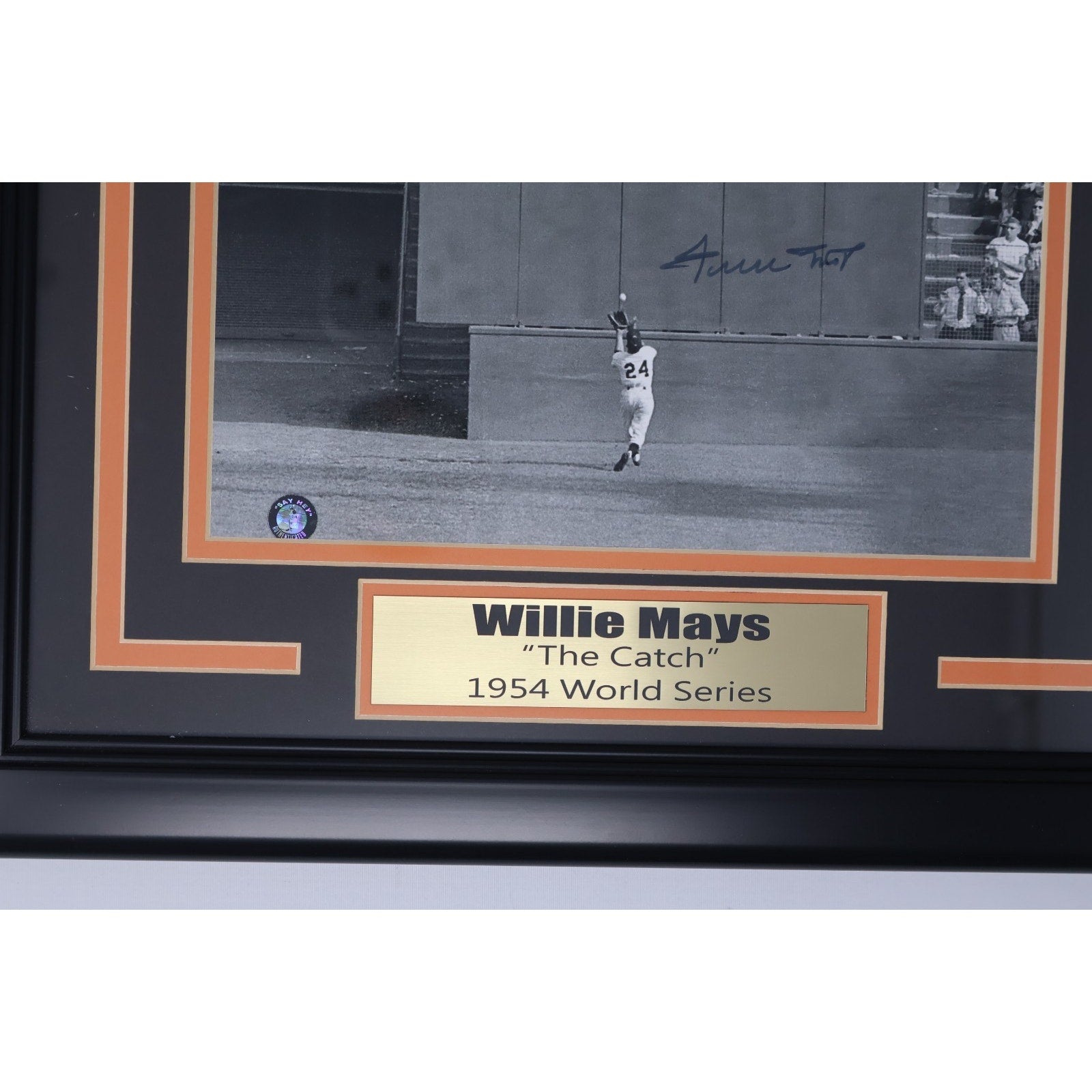 Name plaque detail reading Willie Mays beneath signed framed photograph