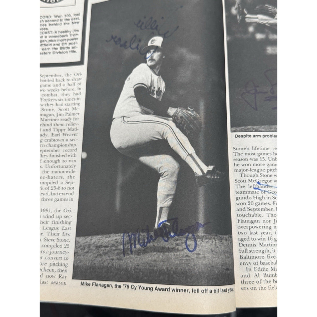 Vintage baseball publication page with player photo and authenticated autograph collectible display