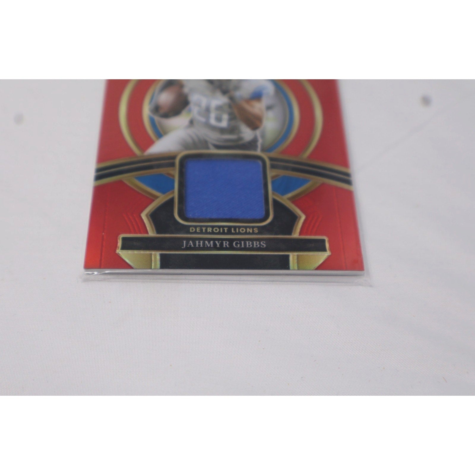 2023 Panini Select - Rookie Swatches Jahmyr Gibbs #RSW-JGI Red Prizm RC Mint