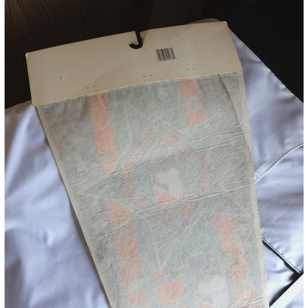 Rear packaging and mounting section of vintage pennant collectible