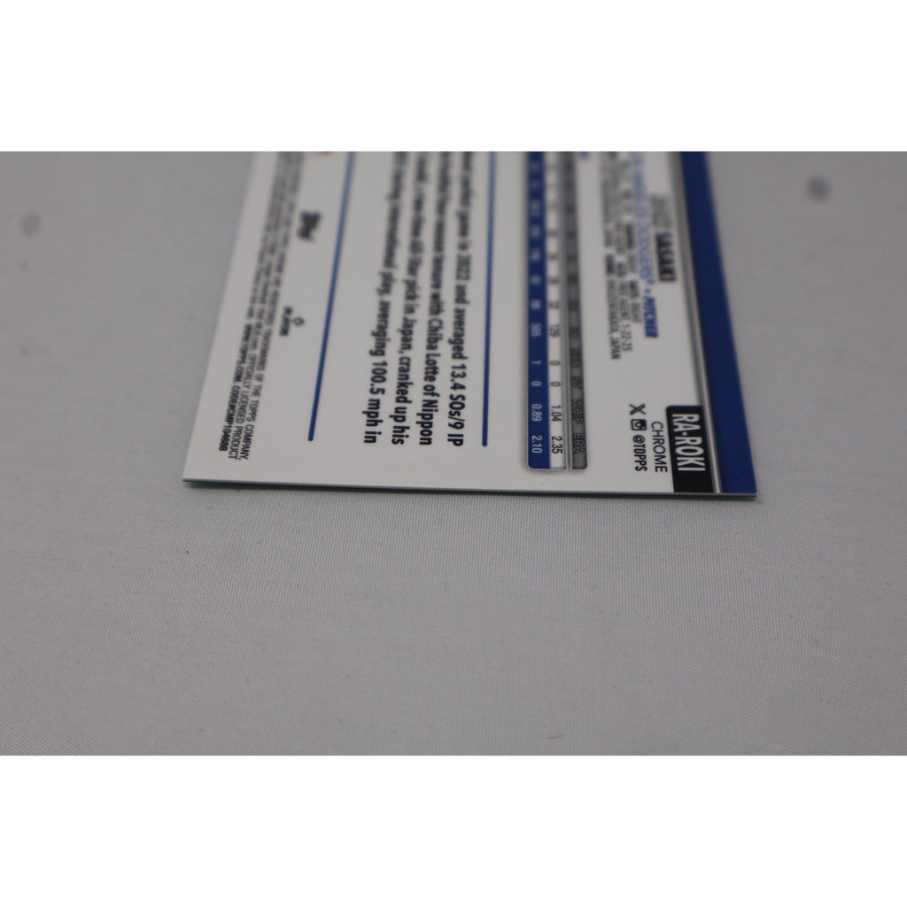 Close-up of card back text and serial numbering on 2025 Topps Chrome Roki Sasaki Aqua Wave Refractor autograph card