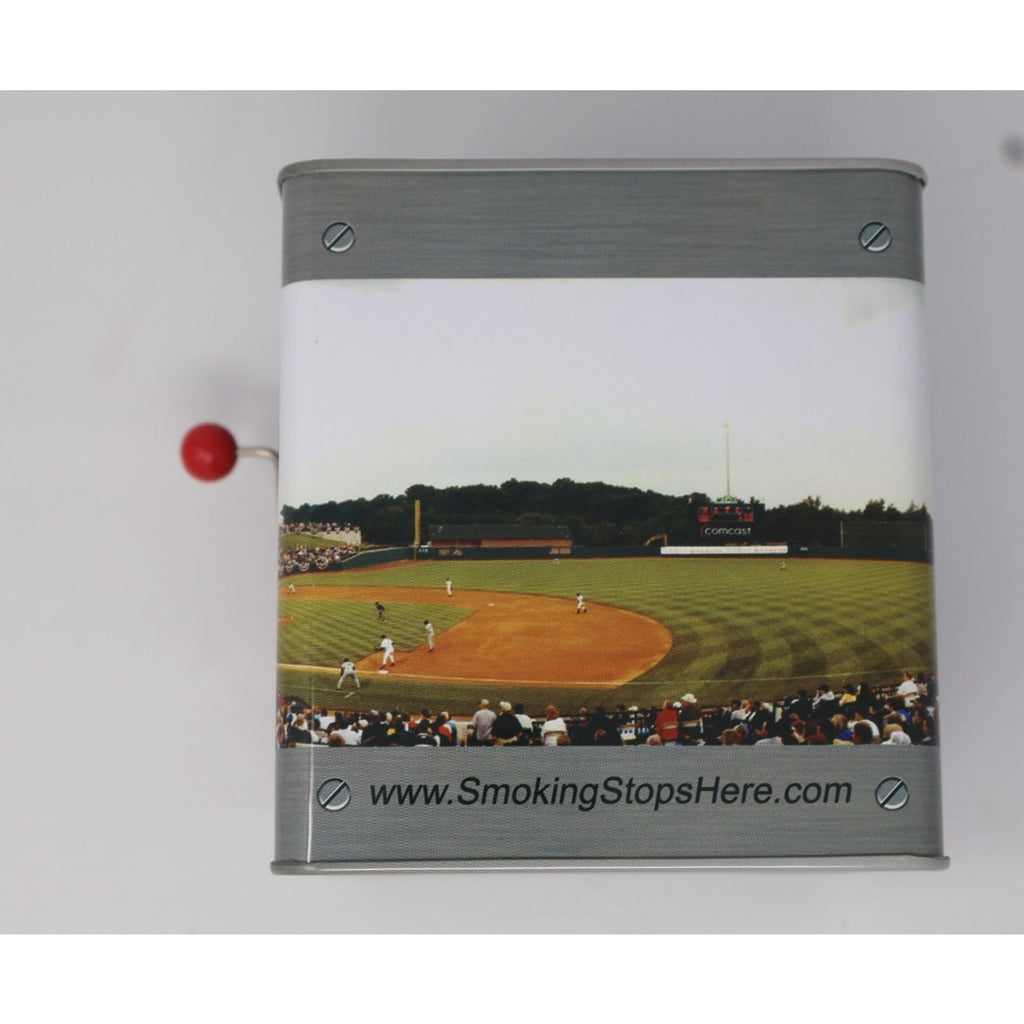 Rear side of collectible jack-in-the-box featuring baseball field image