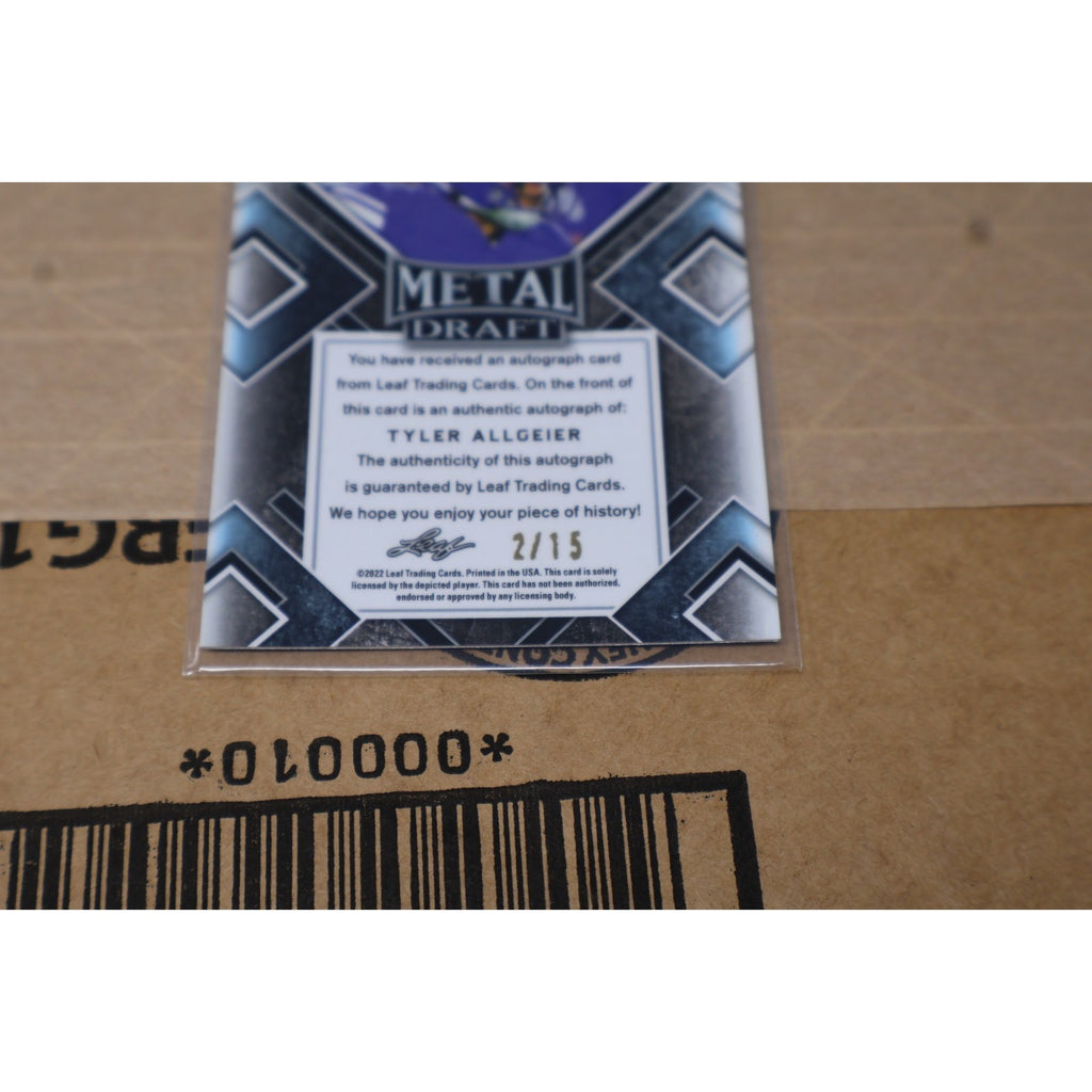 Rear angled view of Tyler Allgeier Black Crystals rookie card numbered /15